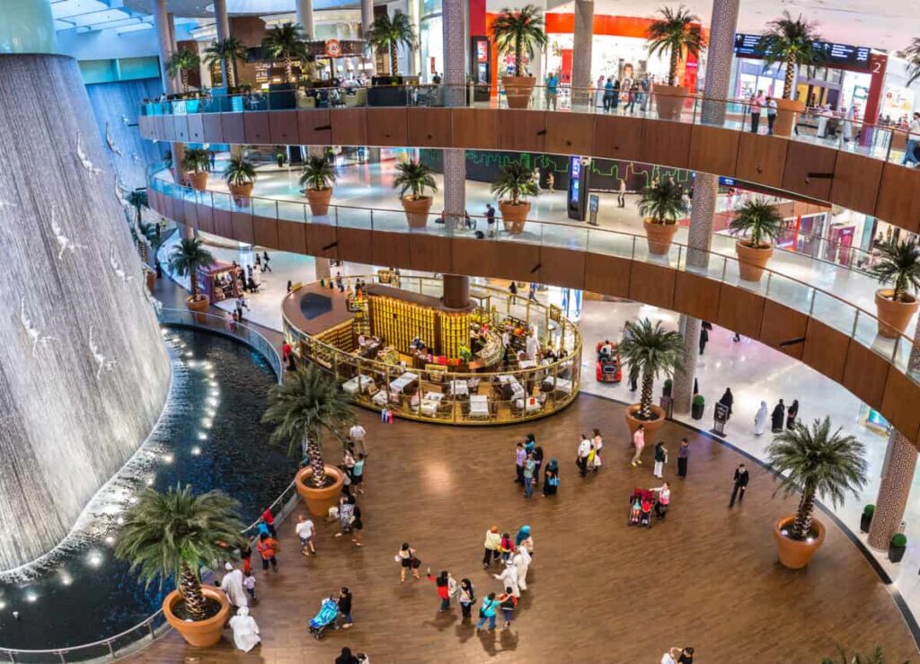 Dubai mall human waterfall showcasing a series of sculpted human figures diving into the water